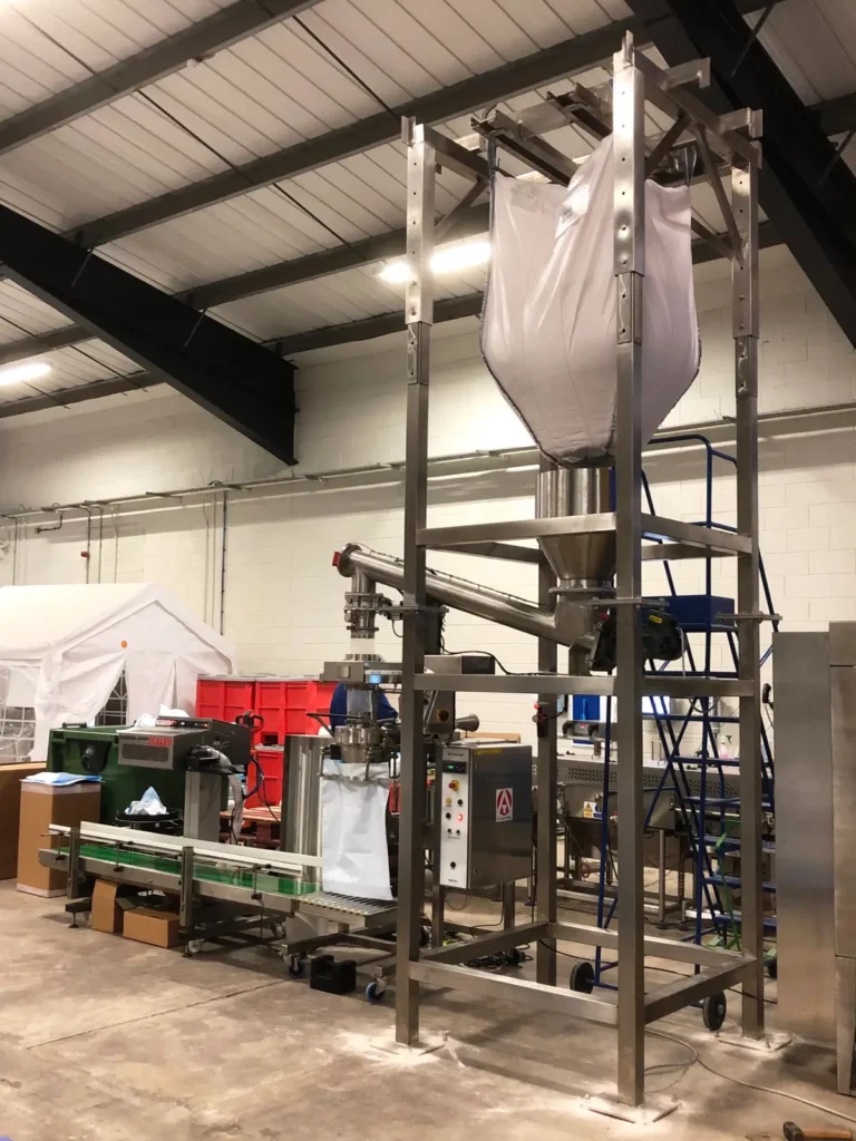 IBC discharger, sack weighing, filling and sealing line